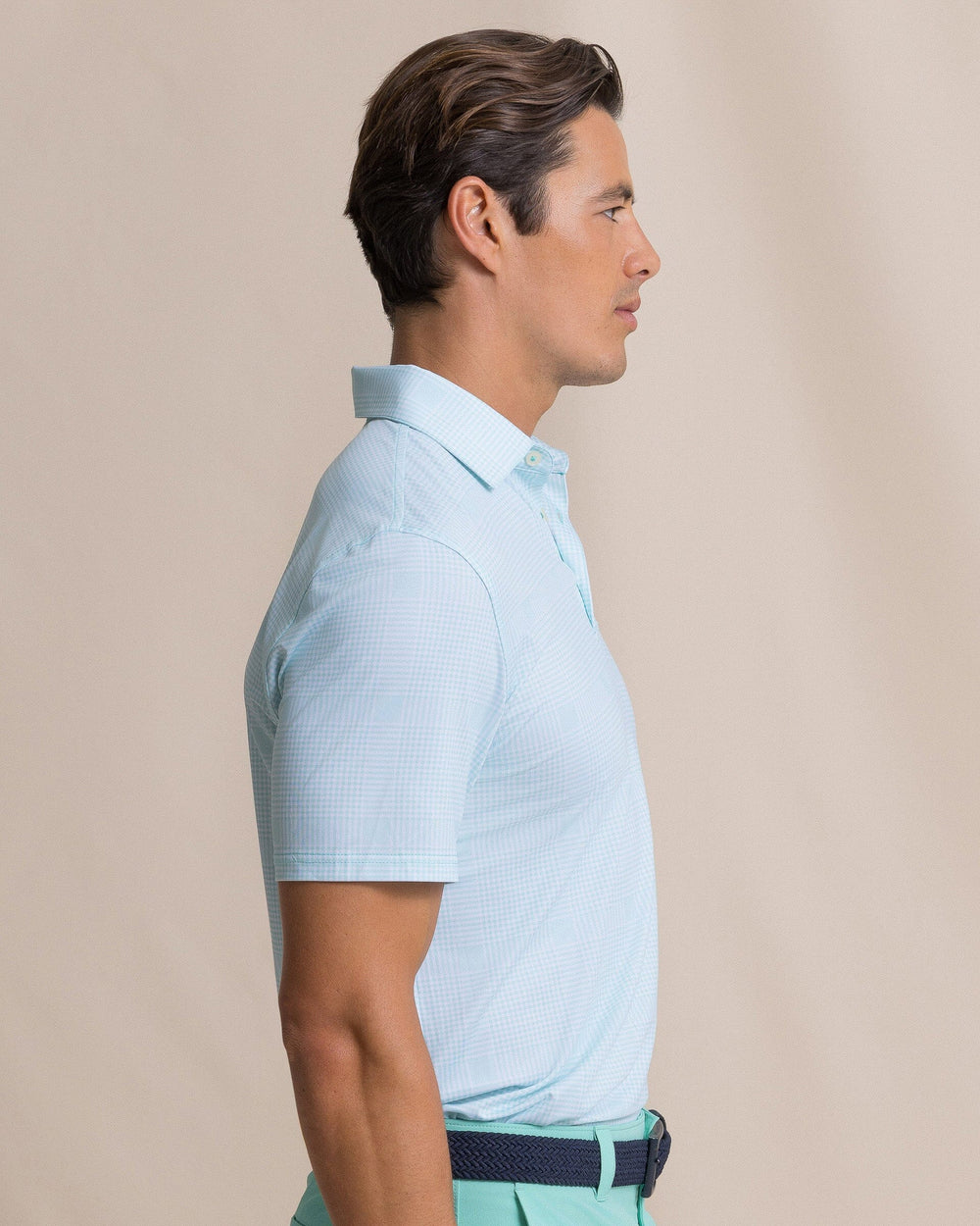 The side view of the Southern Tide Driver Coral Key Plaid Printed Polo by Southern Tide - Gulf Shores