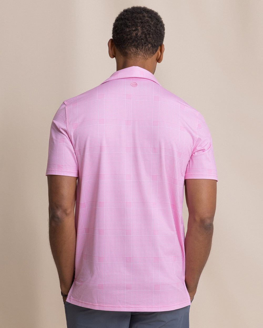 The back view of the Southern Tide Driver Coral Key Plaid Printed Polo by Southern Tide - Sea Pink