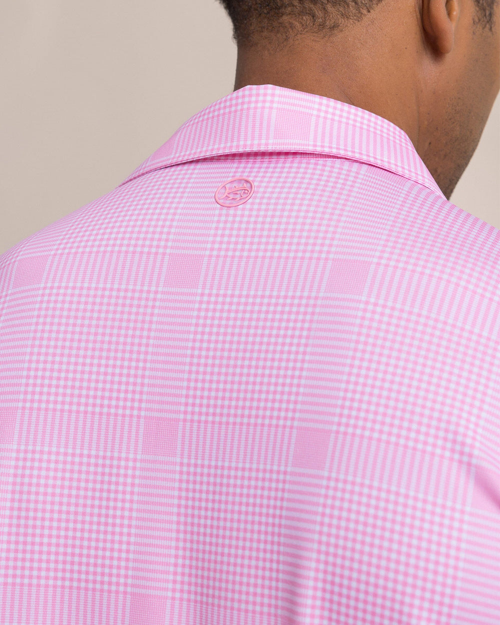 The detail view of the Southern Tide Driver Coral Key Plaid Printed Polo by Southern Tide - Sea Pink