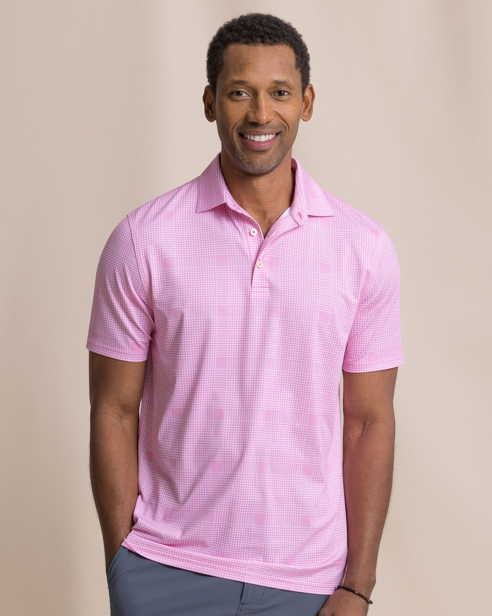 The front view of the Southern Tide Driver Coral Key Plaid Printed Polo by Southern Tide - Sea Pink