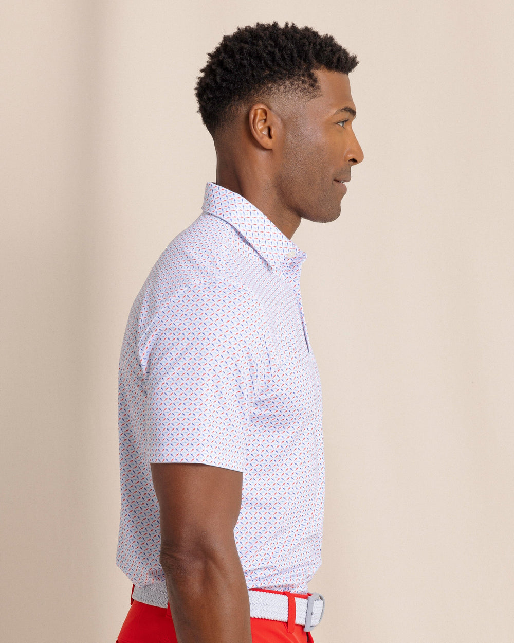 The side view of the Southern Tide Driver Fin-tastic Catch Printed Polo by Southern Tide - Classic White