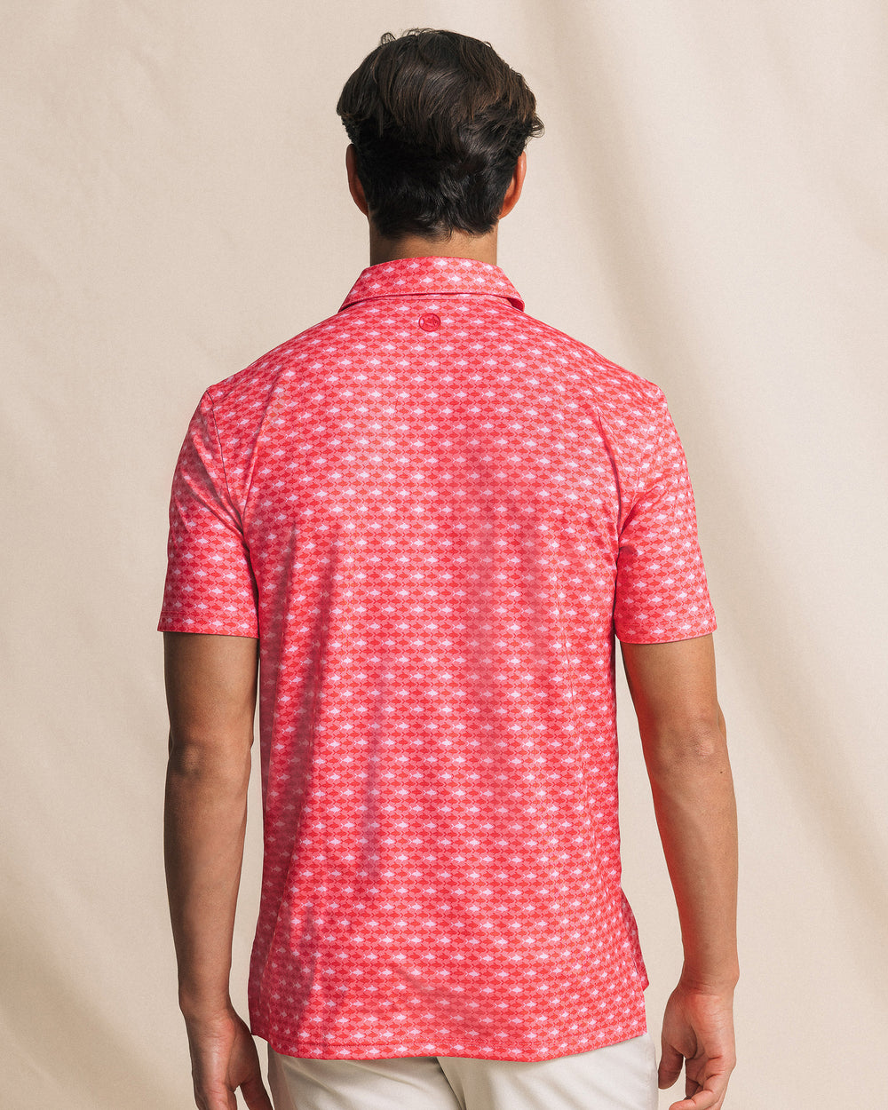 The back view of the Southern Tide Driver Fintastic Frenzy Printed Polo by Southern Tide - Channel Marker Red