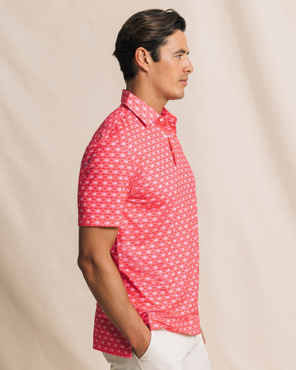 The side view of the Southern Tide Driver Fintastic Frenzy Printed Polo by Southern Tide - Channel Marker Red
