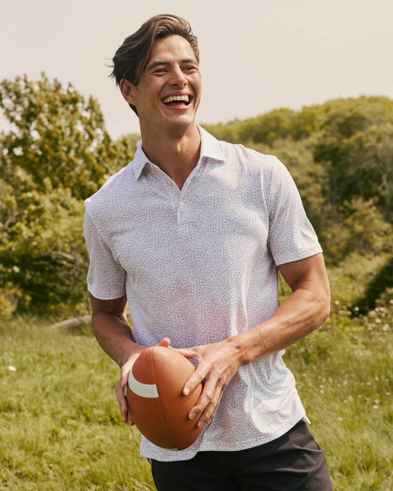 The lifestyle view of the Southern Tide Driver Gameplay Polo by Southern Tide - Classic White