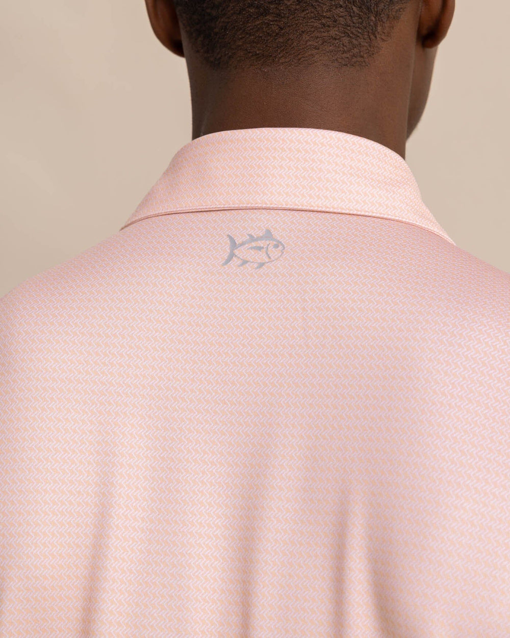 The detail view of the Southern Tide Driver Getting Ziggy With It Printed Polo by Southern Tide - Apricot Blush Coral