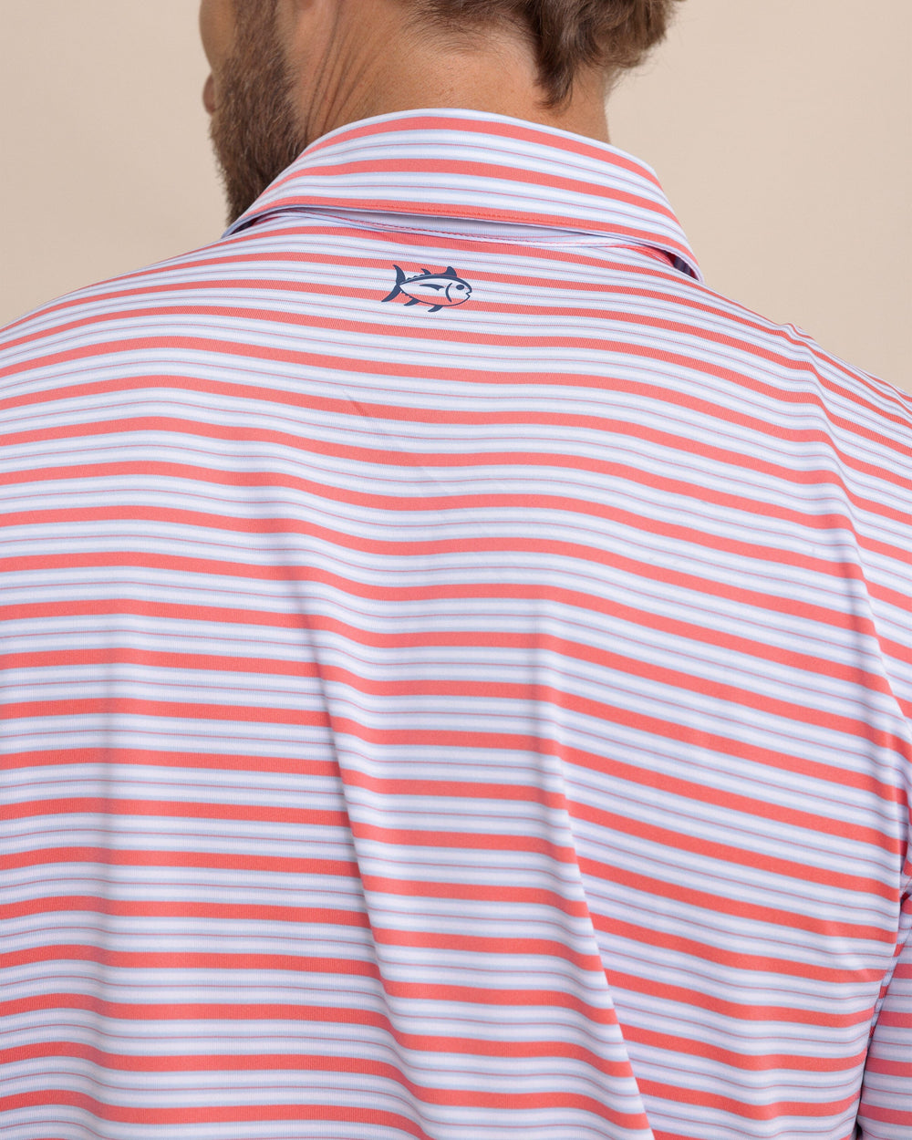 The detail view of the Southern Tide Driver Ocean Hill Stripe Polo by Southern Tide - Sunkist Coral