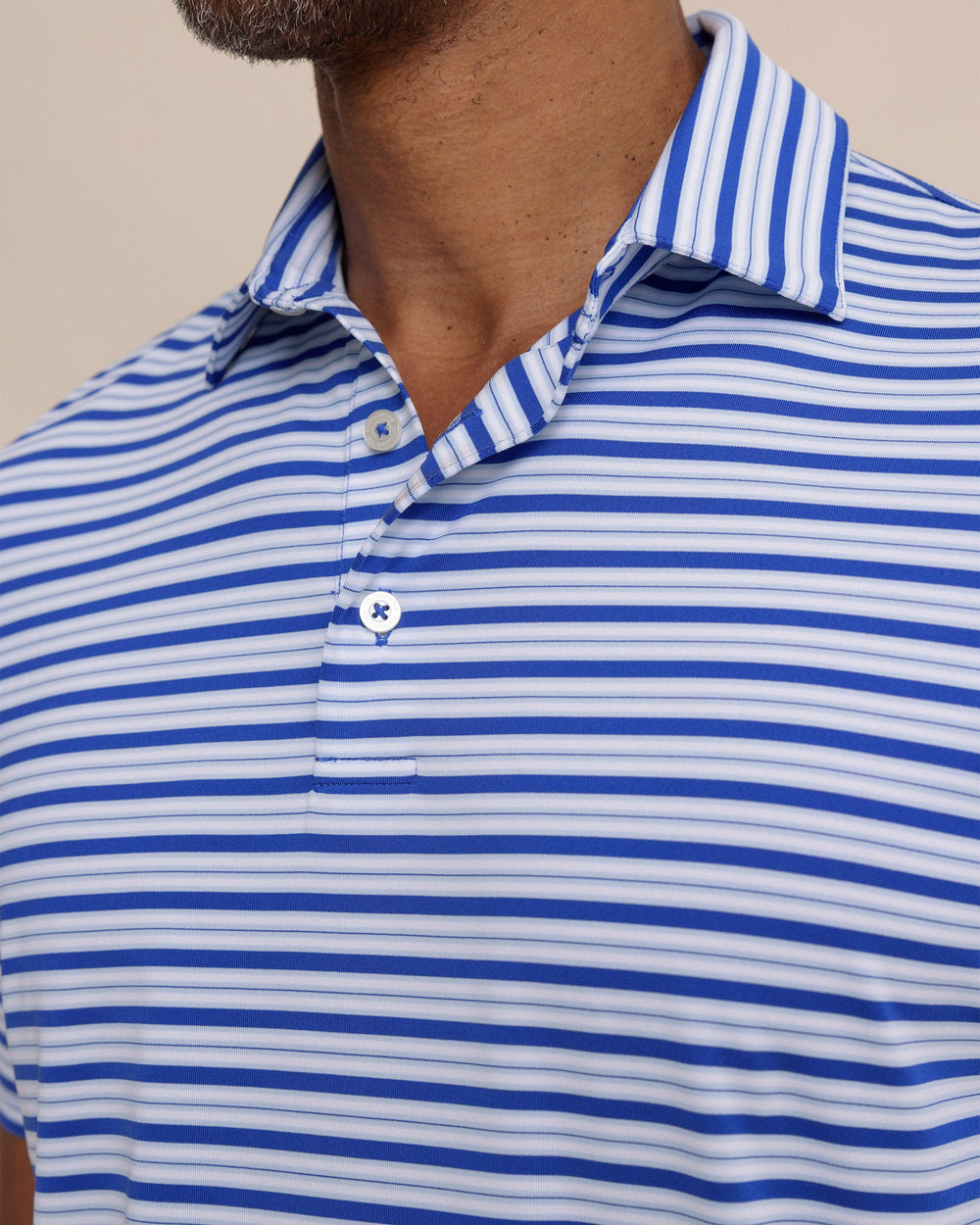 The detail view of the Southern Tide Driver Ocean Hill Stripe Polo by Southern Tide - Surf Blue