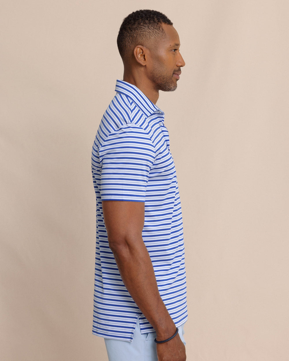 The side view of the Southern Tide Driver Ocean Hill Stripe Polo by Southern Tide - Surf Blue