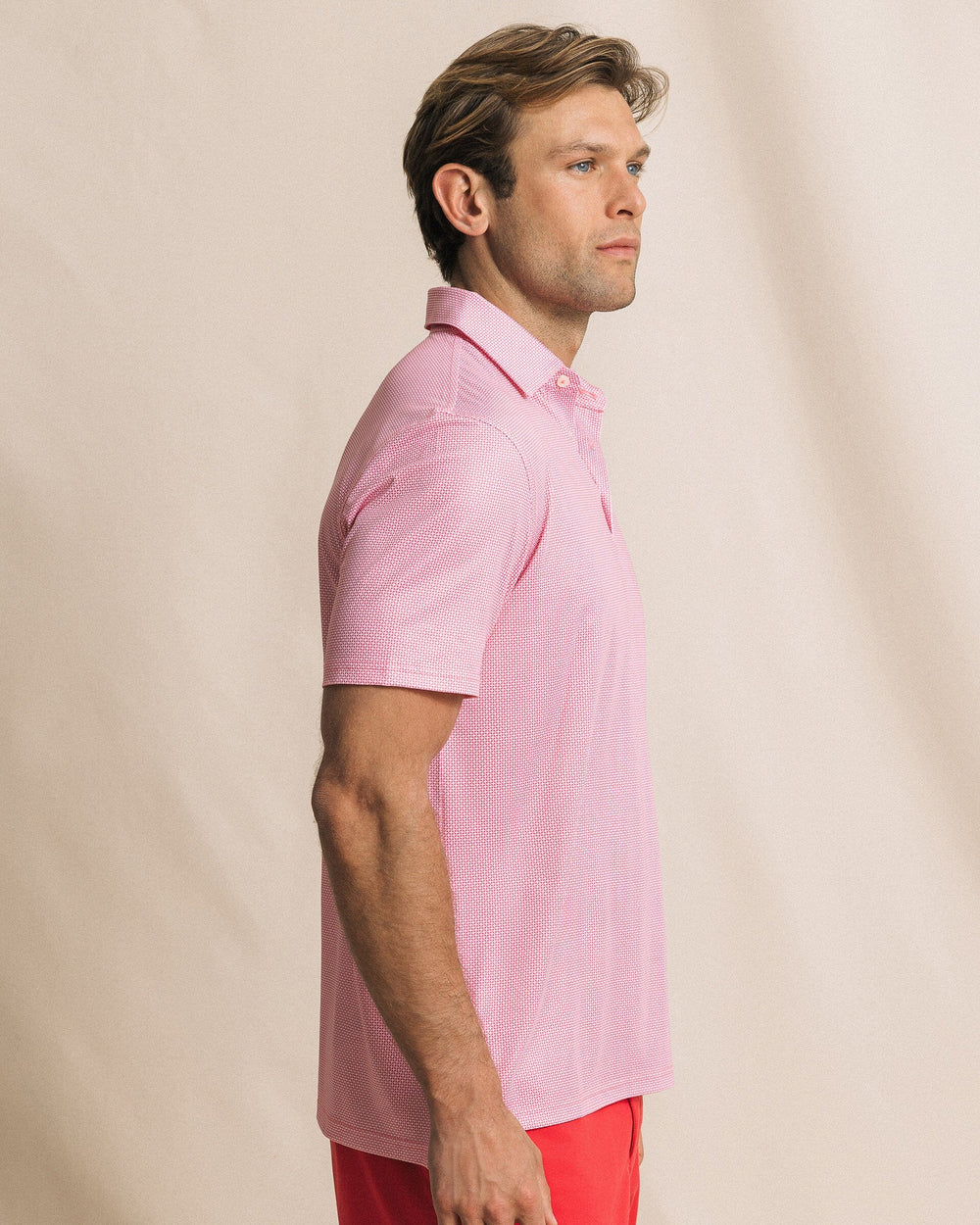 The side view of the Southern Tide Driver Ocean Vista Printed Polo by Southern Tide - Island Pink