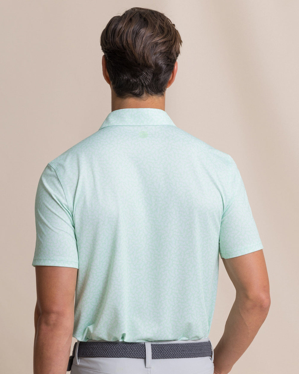 The back view of the Southern Tide Driver Pineapple Parade Printed Polo by Southern Tide - Green Ash