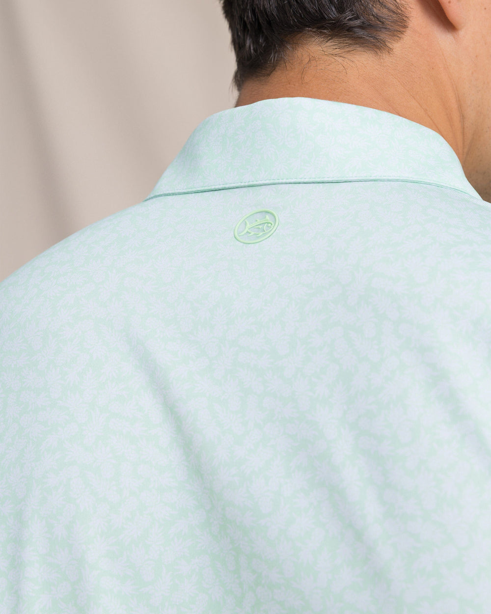 The detail view of the Southern Tide Driver Pineapple Parade Printed Polo by Southern Tide - Green Ash