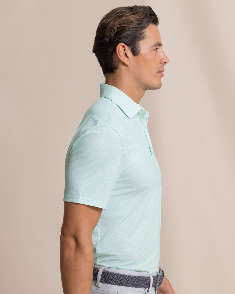 The side view of the Southern Tide Driver Pineapple Parade Printed Polo by Southern Tide - Green Ash
