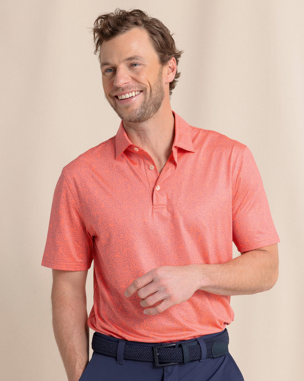The front view of the Southern Tide Driver Pineapple Paradise Printed Polo by Southern Tide - Sunset Coral