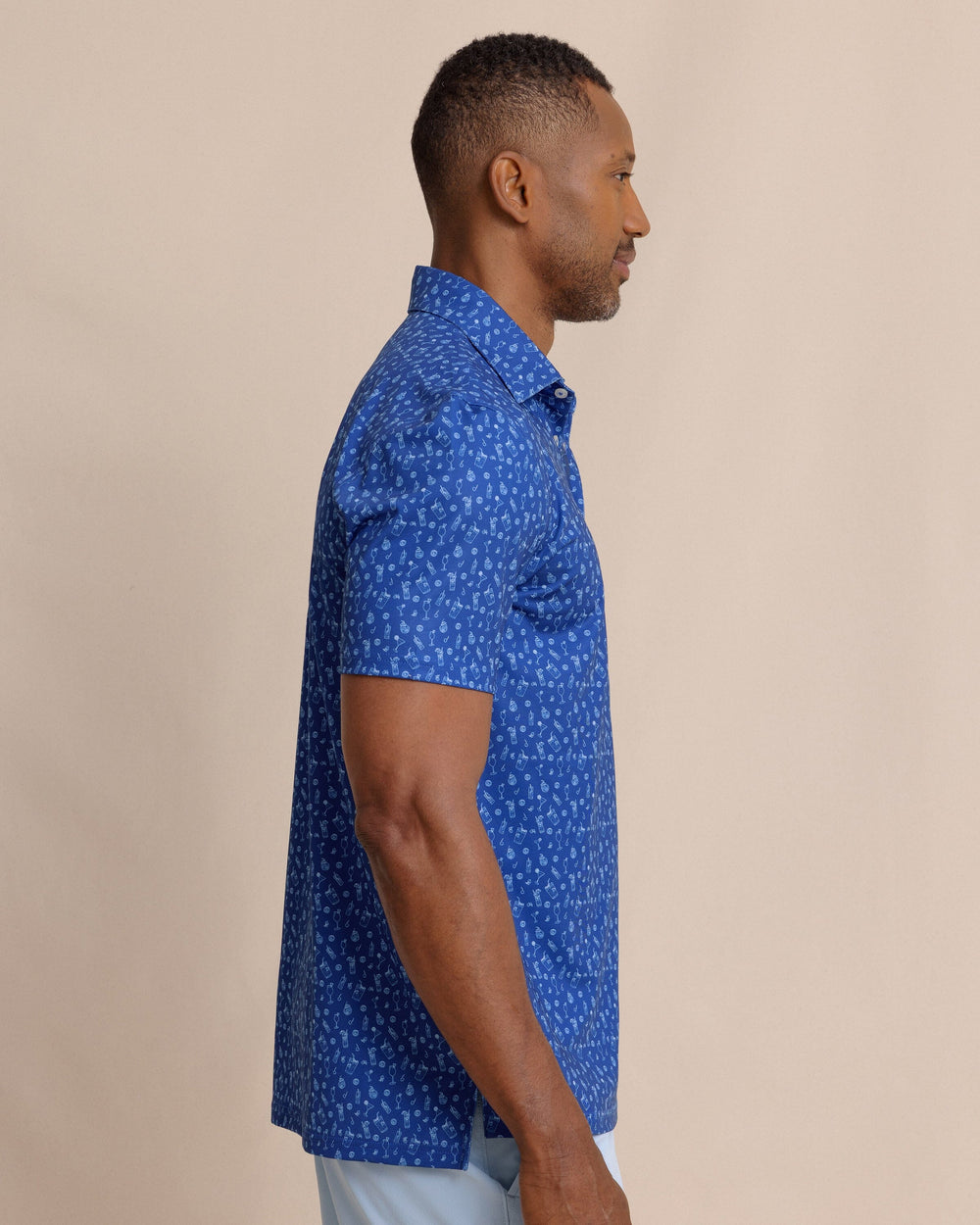 The side view of the Southern Tide Driver Pour Decisions Printed Polo by Southern Tide - Surf Blue