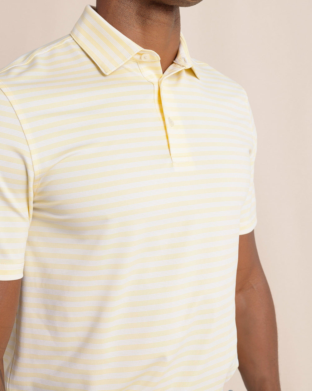 The front detail view of the Southern Tide Driver Sevilla Stripe Polo by Southern Tide - Tuscan Sun