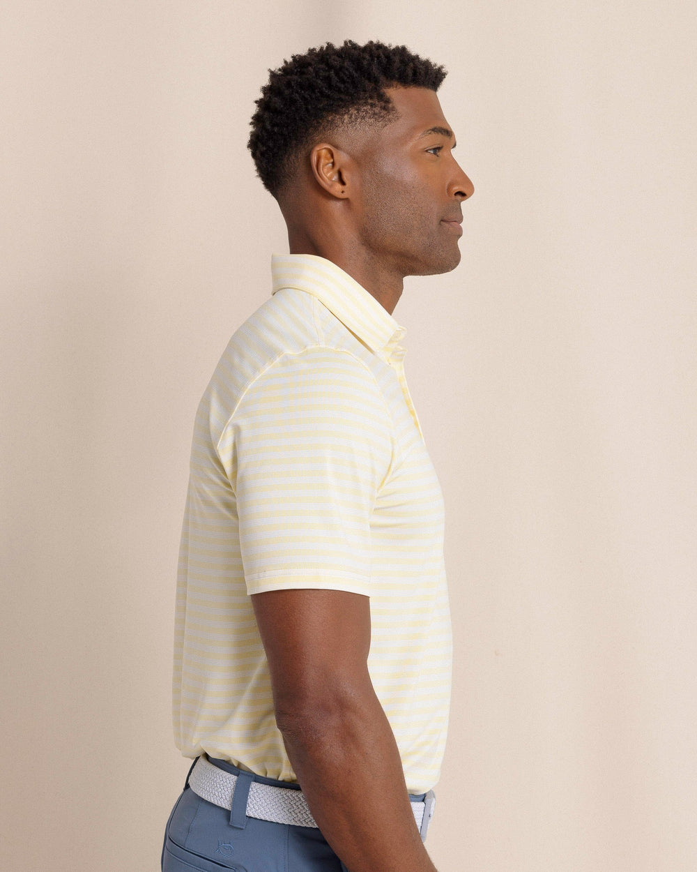 The side view of the Southern Tide Driver Sevilla Stripe Polo by Southern Tide - Tuscan Sun