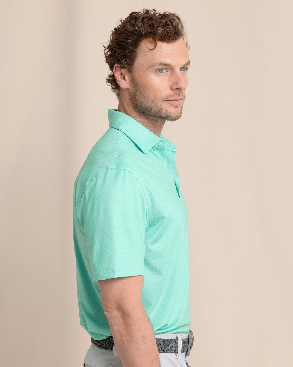 The side view of the Southern Tide Driver Snazzy Scales Printed Polo by Southern Tide - Turtle Green