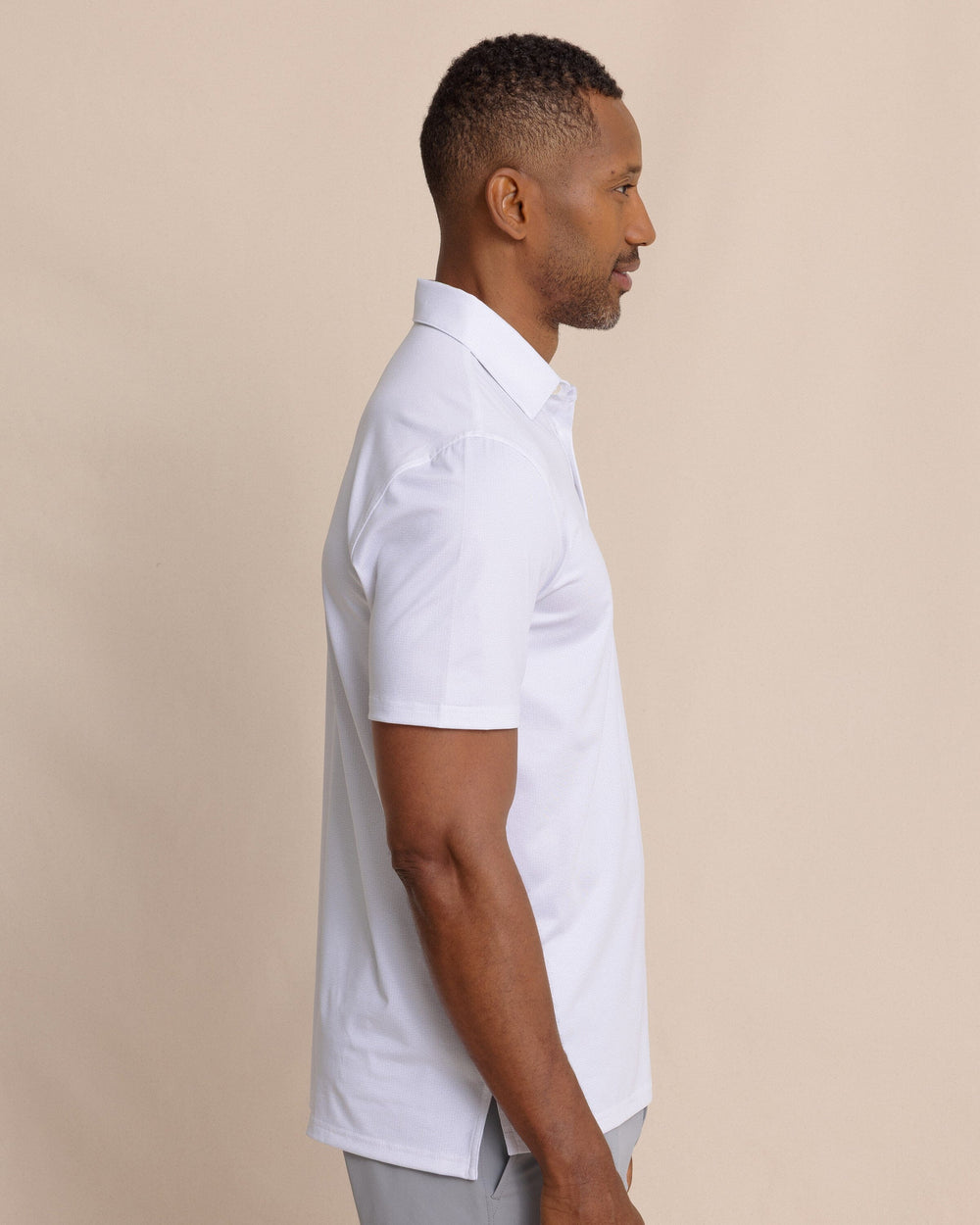 The side view of the Southern Tide Driver ST Geo Printed Polo by Southern Tide - Classic White