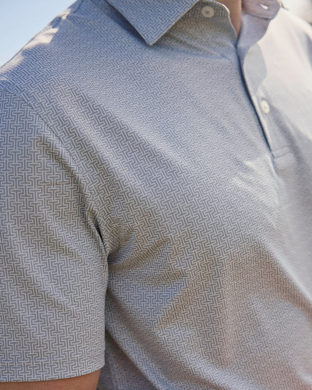 The lifestyle view of the Southern Tide Driver ST Geo Printed Polo by Southern Tide - Steel