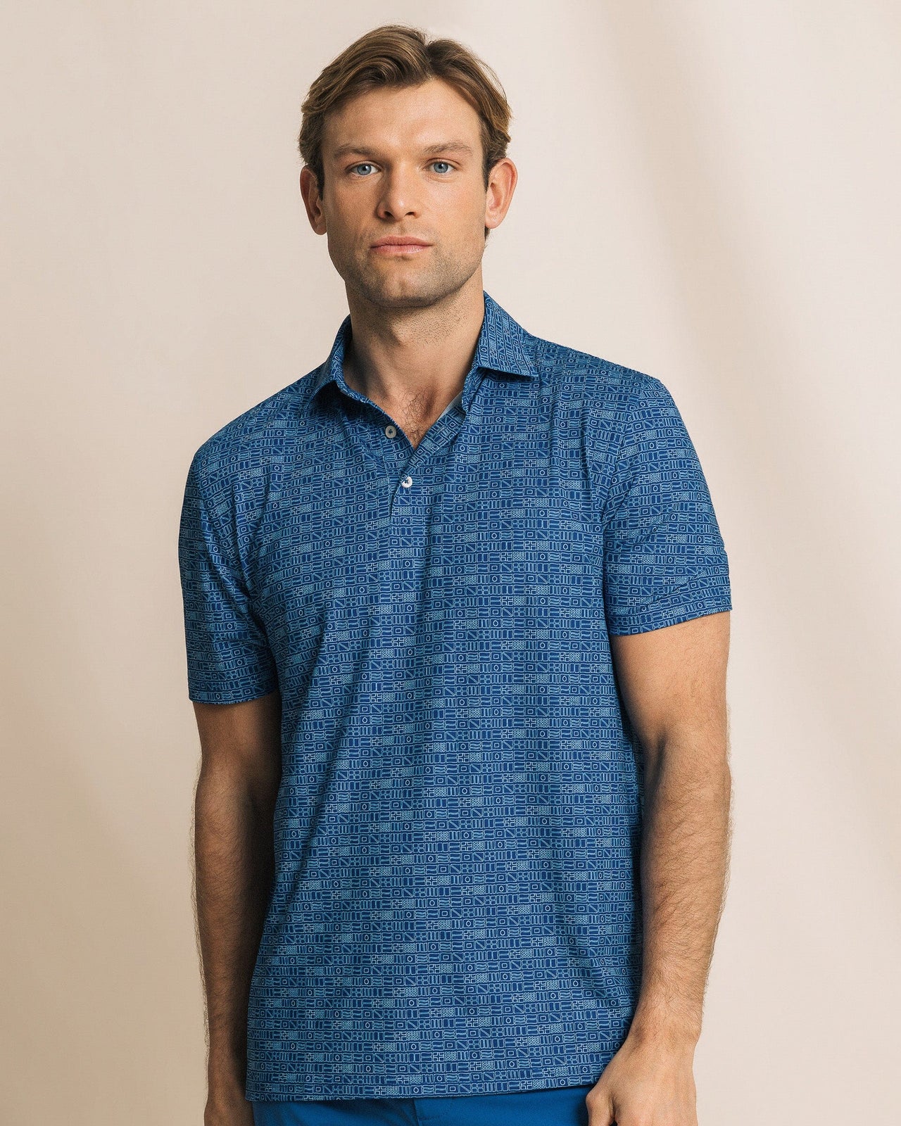 The front view of the Southern Tide Driver ST Nautical Flag Printed Polo by Southern Tide - Nautical Blue