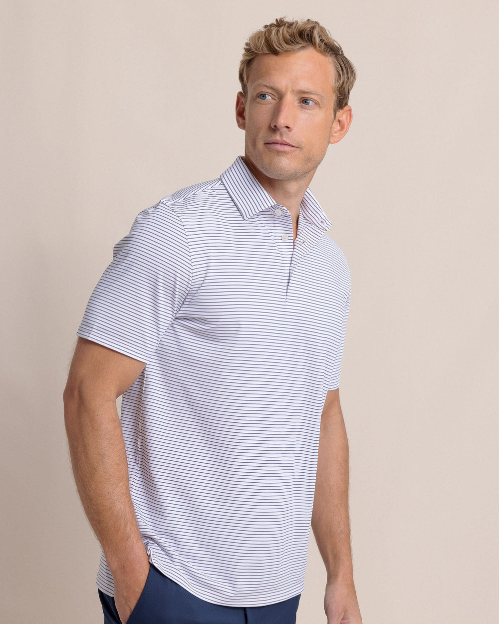 The side view of the Southern Tide Driver Sunbury Stripe Polo by Southern Tide - Classic White