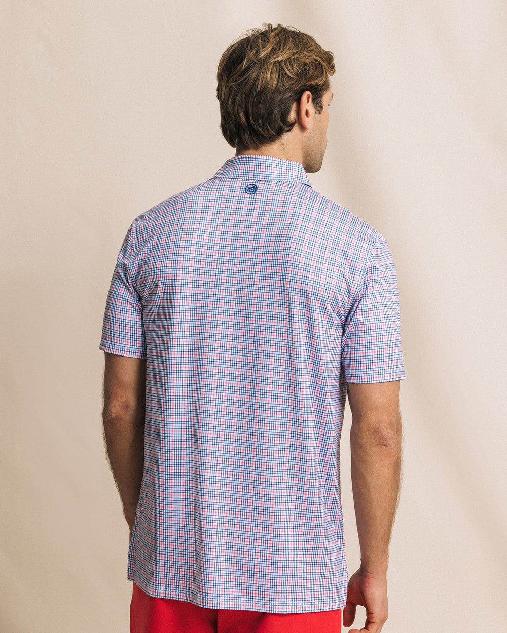 The back view of the Southern Tide Driver Surfside Retreat Plaid Polo by Southern Tide - Island Pink
