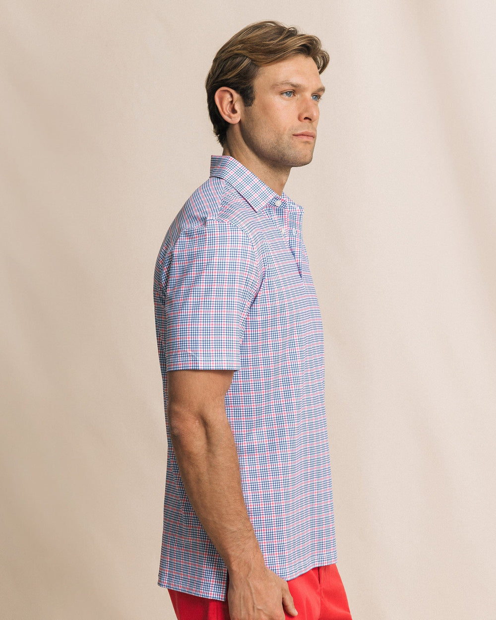 The side view of the Southern Tide Driver Surfside Retreat Plaid Polo by Southern Tide - Island Pink