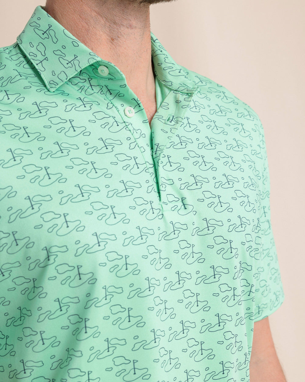 The front detail view of the Southern Tide Driver Who's Your Caddy Polo by Southern Tide - Jade Green