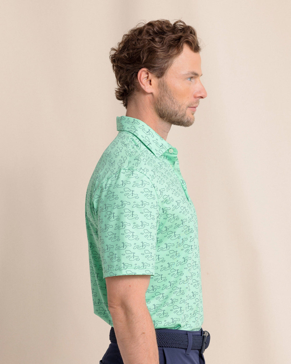 The side view of the Southern Tide Driver Who's Your Caddy Polo by Southern Tide - Jade Green