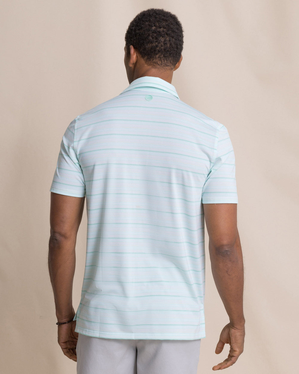 The back view of the Southern Tide Driver Wild Winds Stripe Polo by Southern Tide - Heather Gulf Shores
