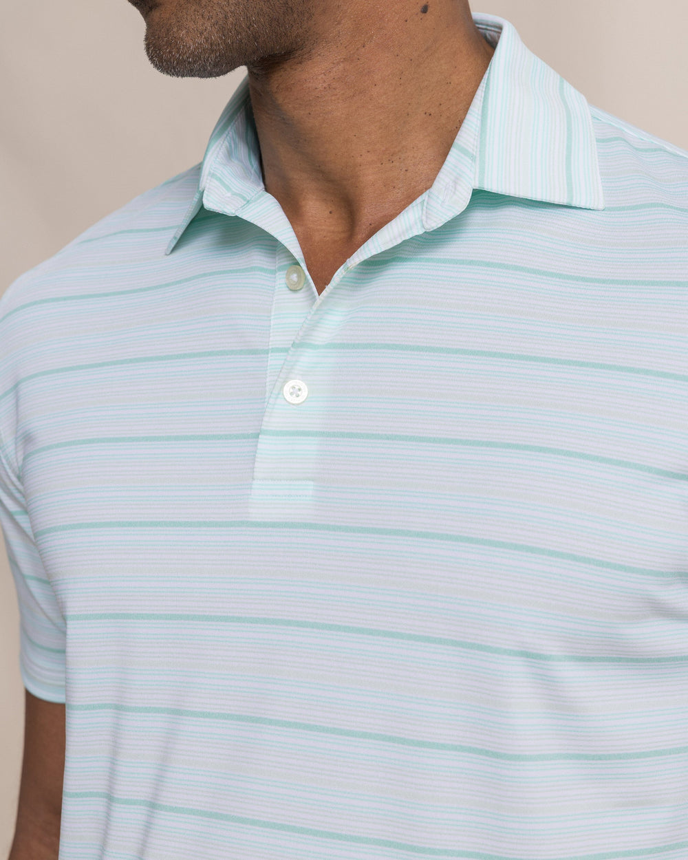 The detail view of the Southern Tide Driver Wild Winds Stripe Polo by Southern Tide - Heather Gulf Shores