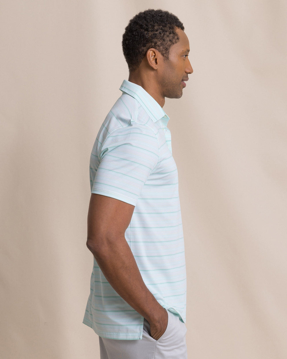 The side view of the Southern Tide Driver Wild Winds Stripe Polo by Southern Tide - Heather Gulf Shores
