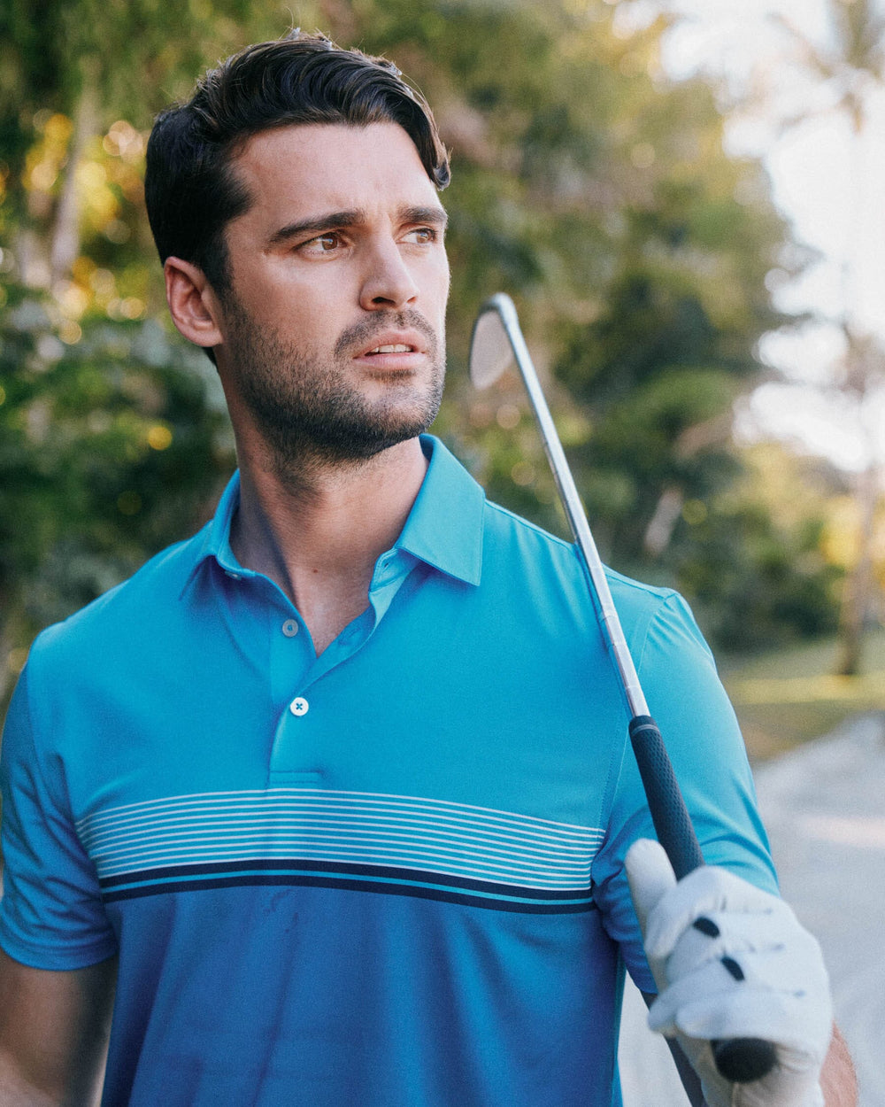 The lifestyle view of the Southern Tide Driver Wildwood Stripe Polo Shirt by Southern Tide - Boat Blue