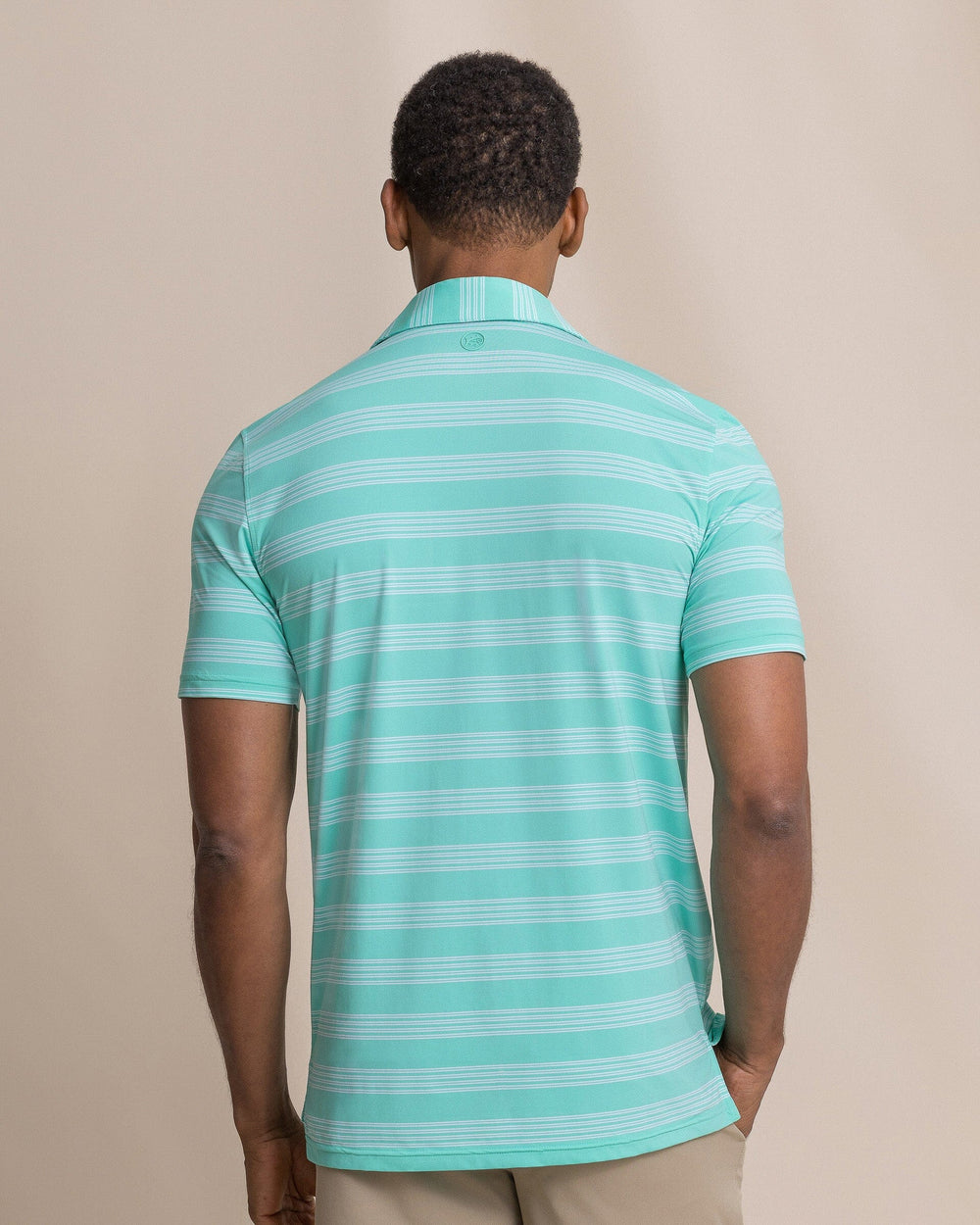 The back view of the Southern Tide Dune Crest Stripe Coastal Breeze® Performance Polo by Southern Tide - Florida Keys