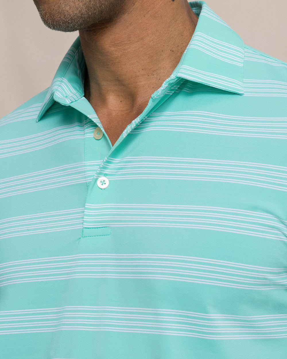 The detail view of the Southern Tide Dune Crest Stripe Coastal Breeze® Performance Polo by Southern Tide - Florida Keys