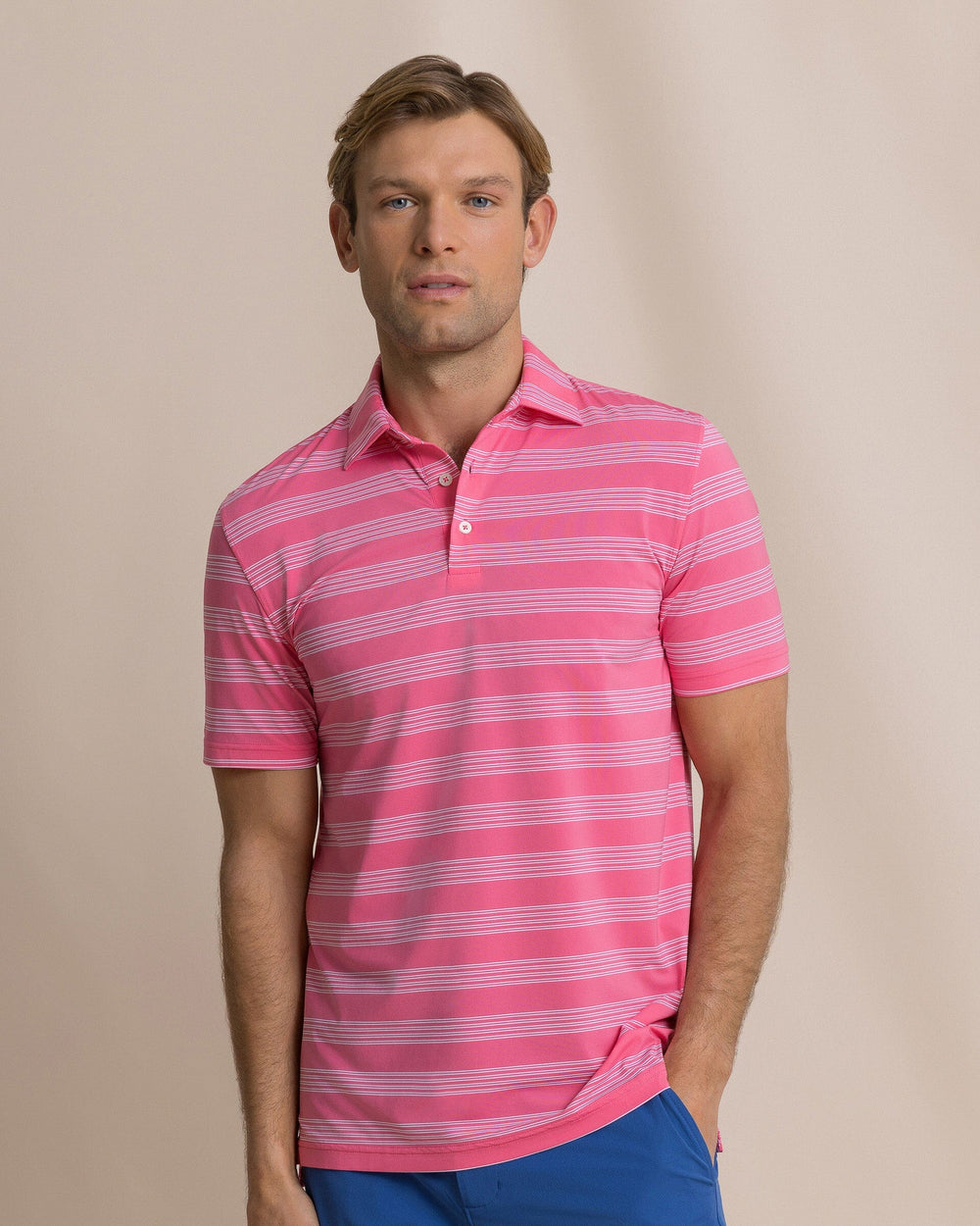 The front view of the Southern Tide Dune Crest Stripe Coastal Breeze® Performance Polo by Southern Tide - Island Pink