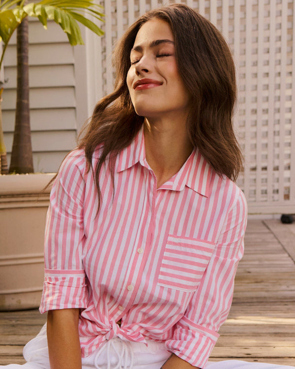 The lifestyle view of the Southern Tide Emery Button Front Shirt by Southern Tide - Sea Pink