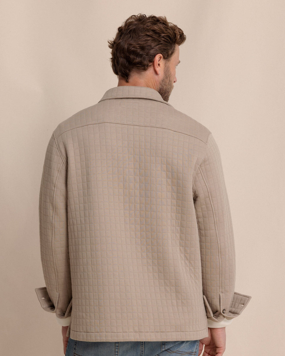 The back view of the Southern Tide Fairwood Quilted Knit Shacket by Southern Tide - Sandstone Khaki