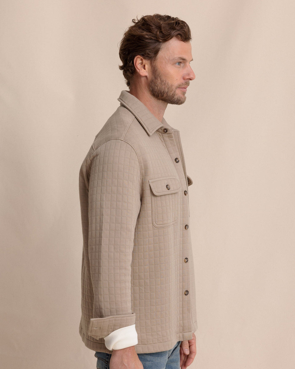 The side view of the Southern Tide Fairwood Quilted Knit Shacket by Southern Tide - Sandstone Khaki