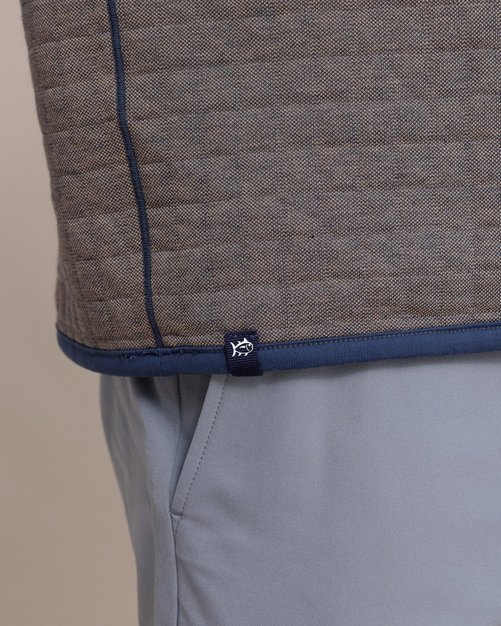 The hem view of the Southern Tide Fairwood Reversible Quarter Zip by Southern Tide - Dress Blue