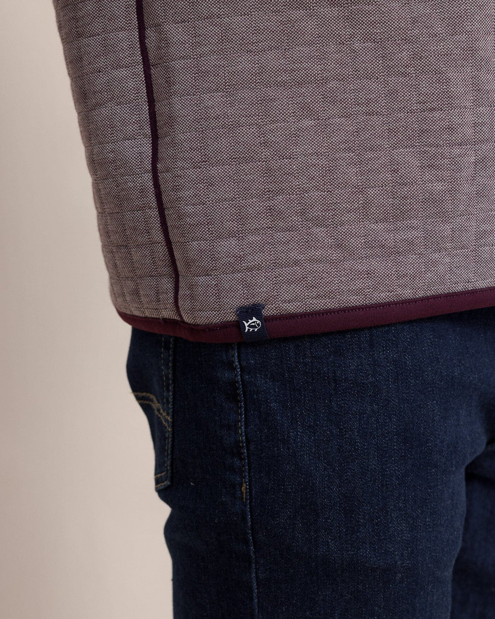 The hem view of the Southern Tide Fairwood Reversible Quarter Zip by Southern Tide - Merlot