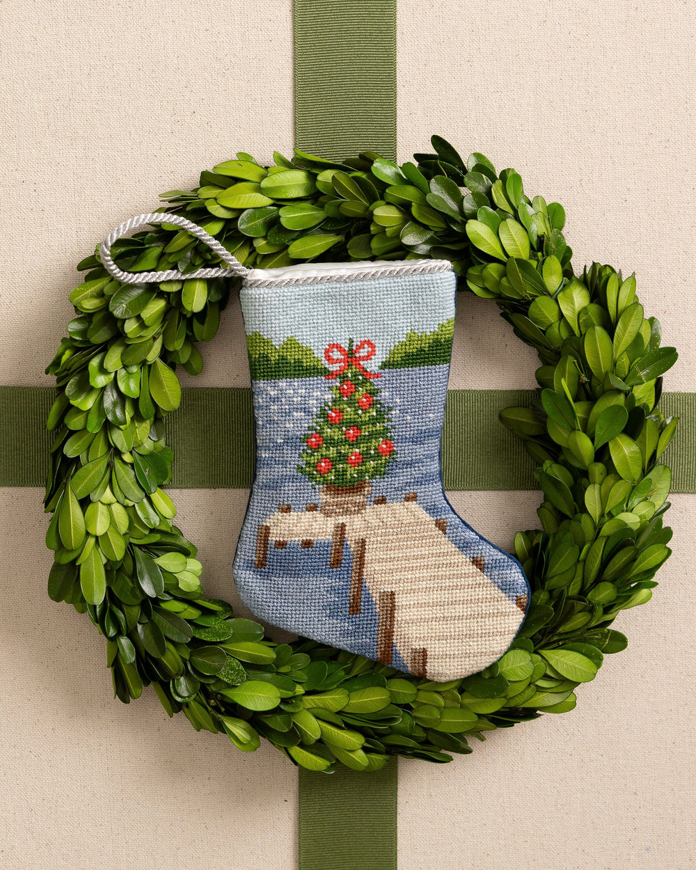 The front view of the Southern Tide Festive Fir Needlepoint Stocking by Southern Tide - Blue