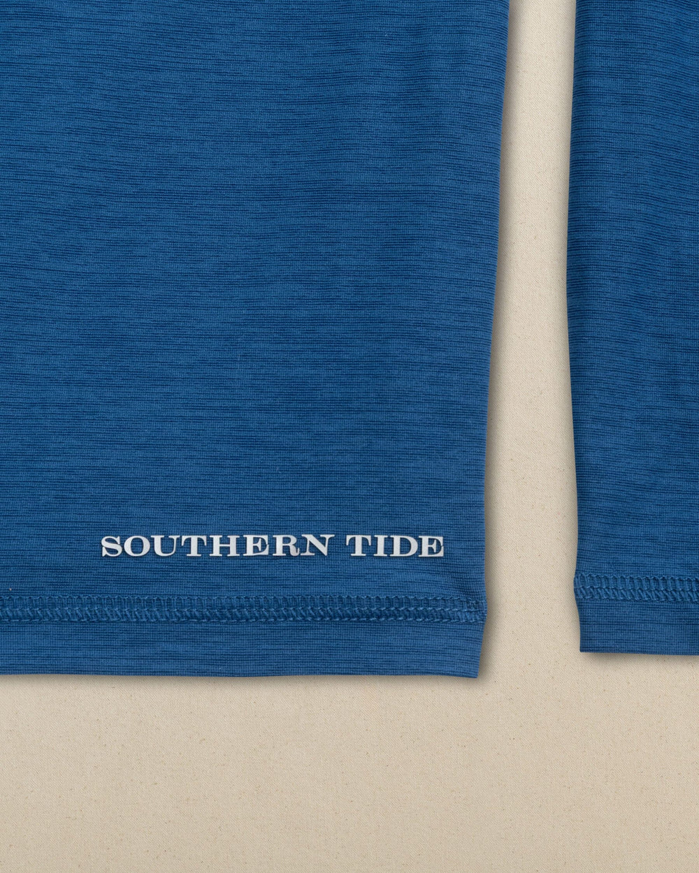 The detail view of the Southern Tide Fishing Lines Coastal Breeze® Performance Hoodie by Southern Tide - Nautical Blue