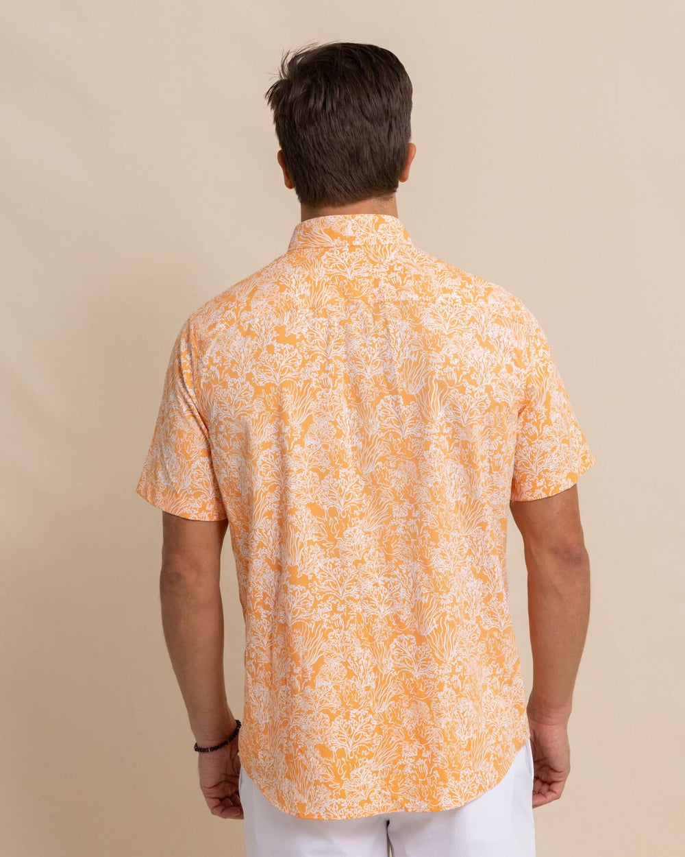 The back view of the Southern Tide Floral Coral Intercoastal Short Sleeve Sport Shirt by Southern Tide - Tangerine Orange