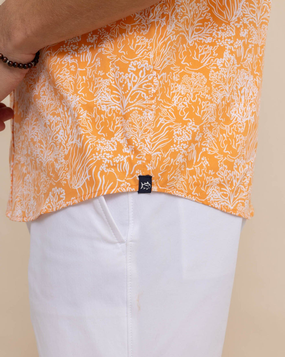 The detail view of the Southern Tide Floral Coral Intercoastal Short Sleeve Sport Shirt by Southern Tide - Tangerine Orange