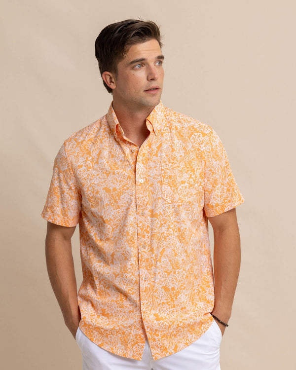 The front view of the Southern Tide Floral Coral Intercoastal Short Sleeve Sport Shirt by Southern Tide - Tangerine Orange