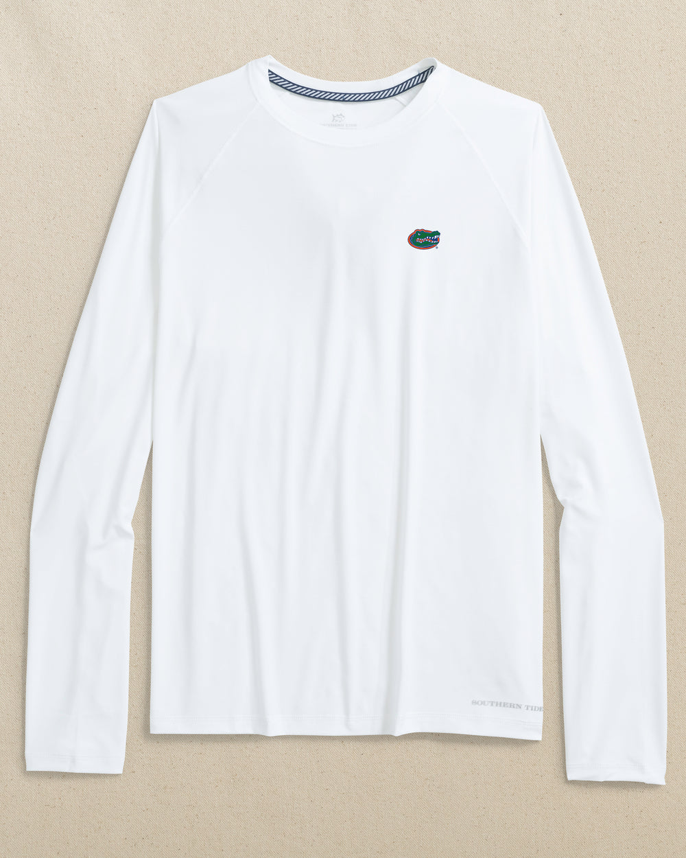 The front view of the Southern Tide Florida Gators brrr°®-illiant Performance Long Sleeve T-Shirt by Southern Tide - Classic White