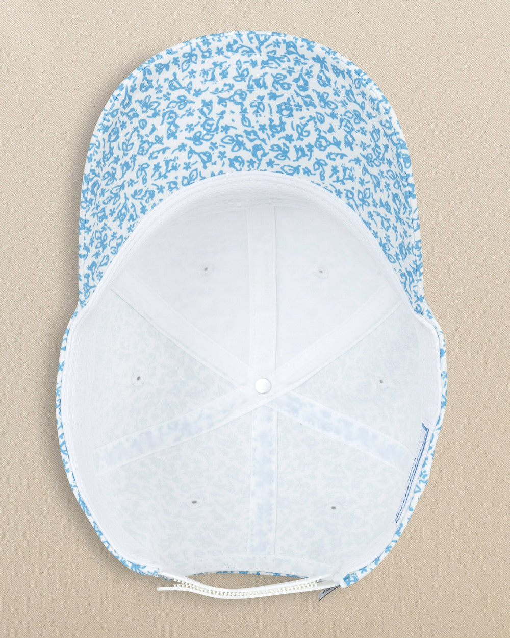 The under view of the Southern Tide Flower Frenzy Performance Hat by Southern Tide - White