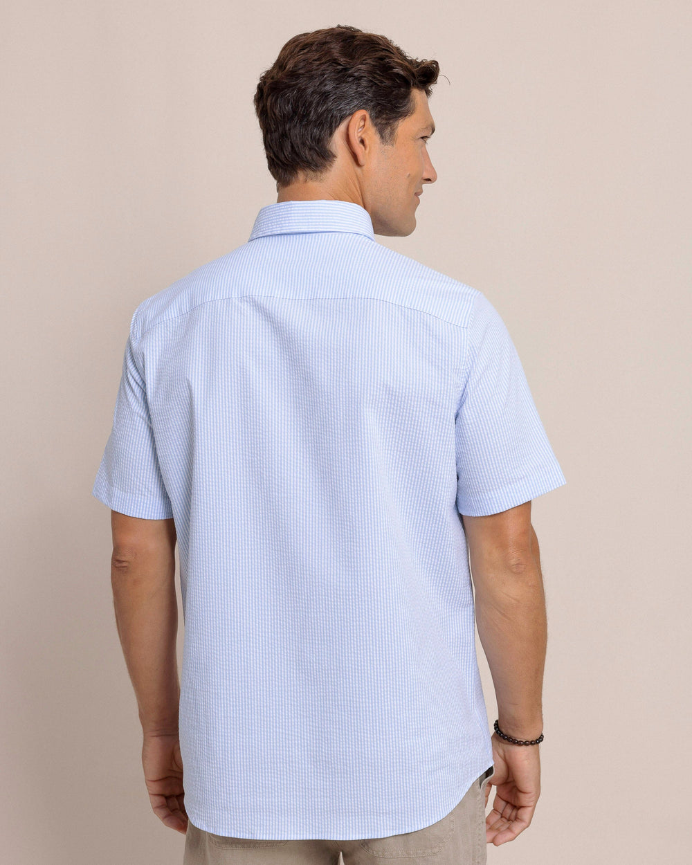 The back view of the Southern Tide Folly Field Stripe Seersucker Short Sleeve Sport Shirt by Southern Tide - Ocean Channel