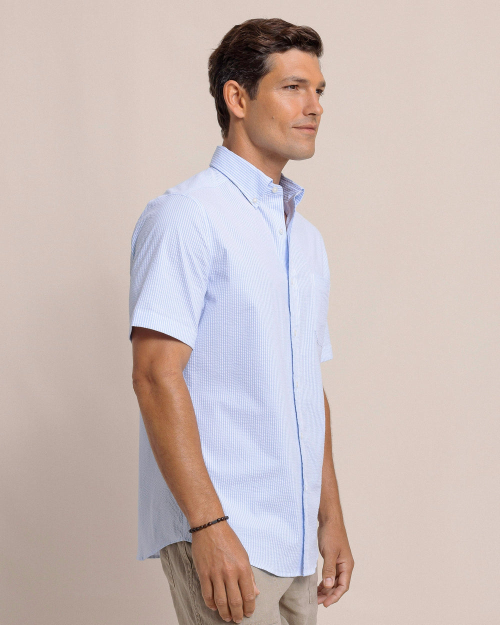 The side view of the Southern Tide Folly Field Stripe Seersucker Short Sleeve Sport Shirt by Southern Tide - Ocean Channel